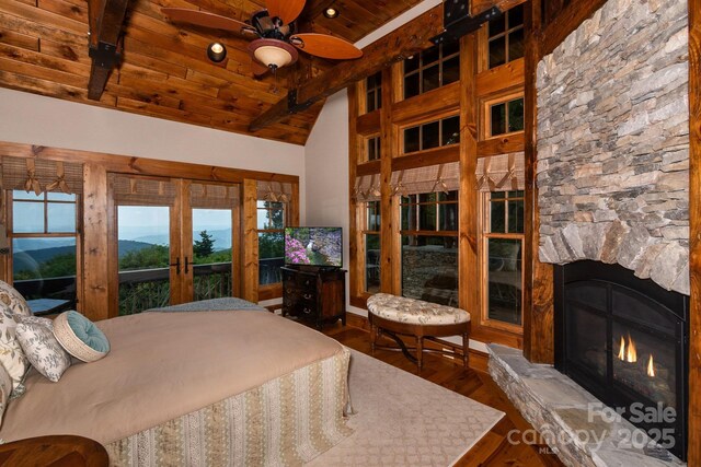 610 Rocky Pkwy Unit 52, 47A, Banner Elk, NC 28604 - bedroom with wooden ceiling with exposed beams, wood finished floors, a stone fireplace, and high vaulted ceiling