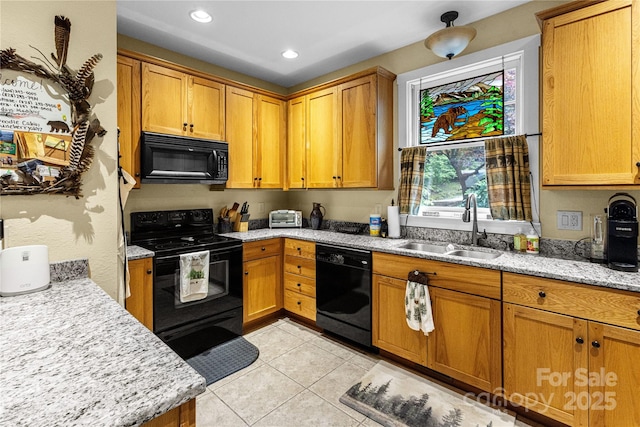 172 Juneberry Ln, Tuckasegee, NC 28783 - kitchen featuring black appliances, a sink, light tile patterned floors, light stone counters, and recessed lighting