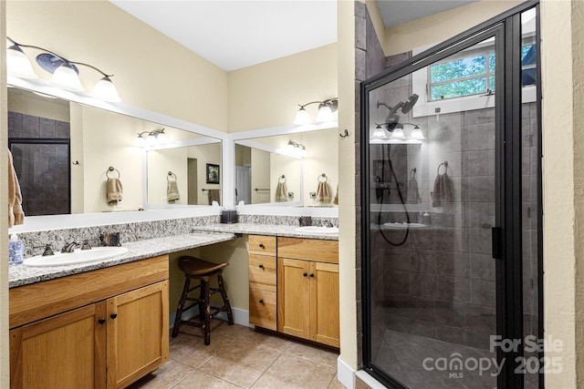 172 Juneberry Ln, Tuckasegee, NC 28783 - bathroom with double vanity, a stall shower, and tile patterned flooring