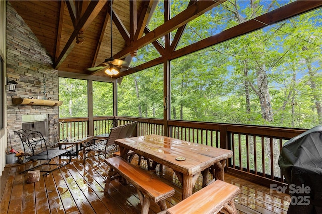 172 Juneberry Ln, Tuckasegee, NC 28783 - wooden terrace with a stone fireplace, outdoor dining area, and grilling area