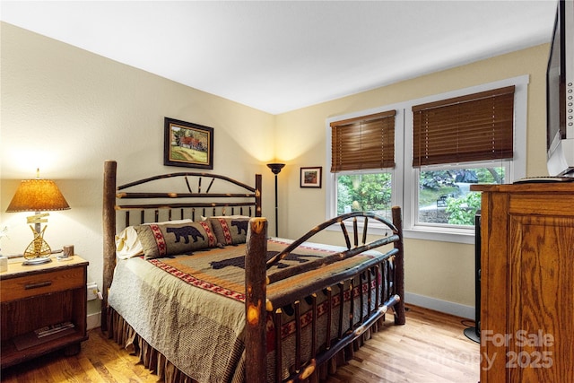 172 Juneberry Ln, Tuckasegee, NC 28783 - bedroom featuring light wood finished floors and baseboards