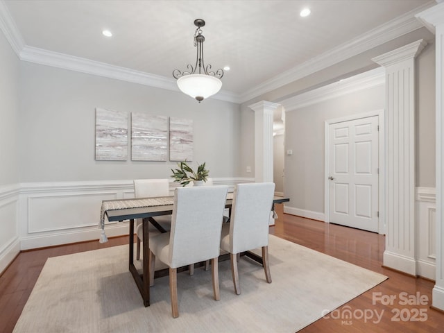 705 Congressional Ln, Fort Mill, SC 29708 - dining space with ornate columns, wood finished floors, a wainscoted wall, recessed lighting, and ornamental molding