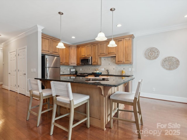 705 Congressional Ln, Fort Mill, SC 29708 - kitchen with stainless steel appliances, ornamental molding, light wood-style floors, tasteful backsplash, and baseboards