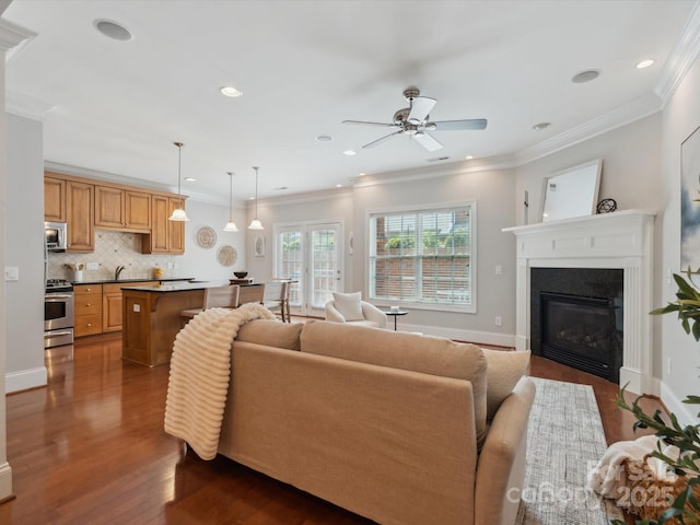 705 Congressional Ln, Fort Mill, SC 29708 - living area featuring ceiling fan, dark wood-style flooring, crown molding, a glass covered fireplace, and recessed lighting