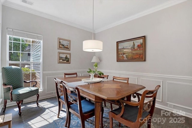 4797 Chesney St NW, Concord, NC 28027 - dining room with a decorative wall, ornamental molding, and a wainscoted wall