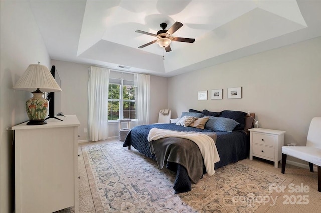 4797 Chesney St NW, Concord, NC 28027 - bedroom with a raised ceiling, light carpet, baseboards, and a ceiling fan