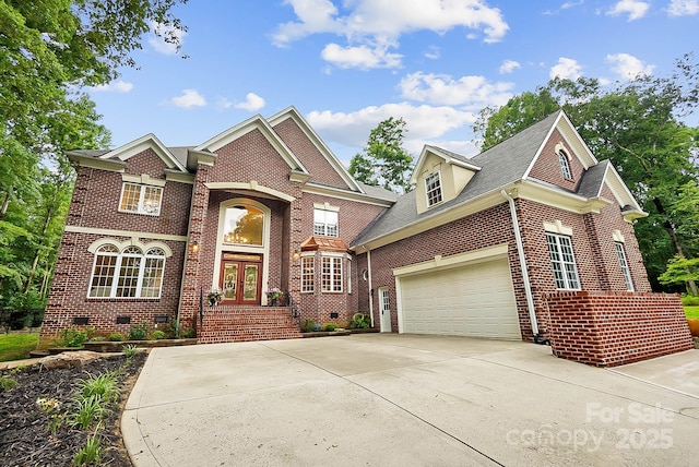 3324 Greenhurst Dr, Weddington, NC 28104 - view of front of property featuring french doors, brick siding, an attached garage, and driveway