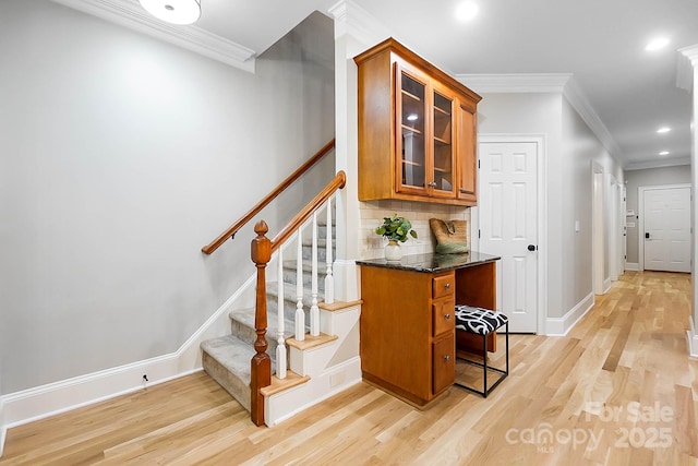3324 Greenhurst Dr, Weddington, NC 28104 - bar area with light wood finished floors, ornamental molding, decorative backsplash, recessed lighting, and stairs