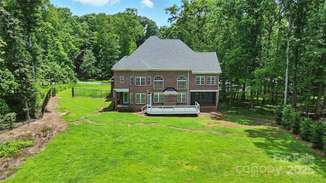 3324 Greenhurst Dr, Weddington, NC 28104 - view of front facade with brick siding, a wooden deck, and a view of trees