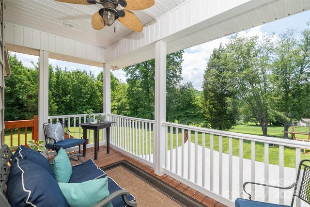 133 Upland Dr, Statesville, NC 28625 - deck with ceiling fan, a lawn, and view of wooded area