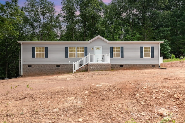 5090 Beaver Dam Way, Bessemer City, NC 28016 - manufactured / mobile home featuring crawl space and view of scattered trees