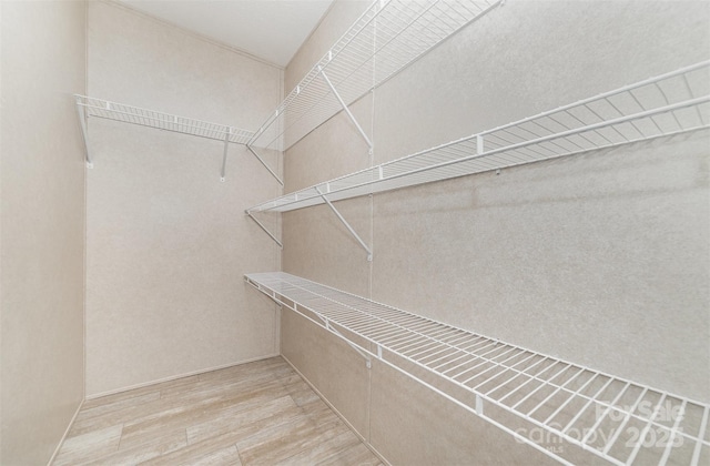 5090 Beaver Dam Way, Bessemer City, NC 28016 - spacious closet featuring wood finished floors