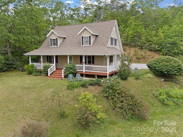 138 Down To Earth Dr, Burnsville, NC 28714 - view of front facade featuring roof with shingles, a front yard, and covered porch