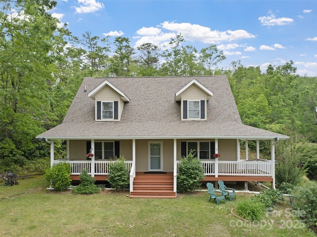 138 Down To Earth Dr, Burnsville, NC 28714 - view of front of house with covered porch, a front lawn, and a shingled roof