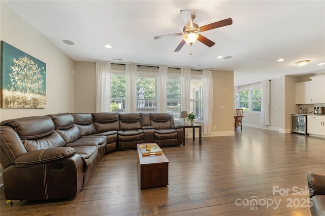 1906 Pensco Pond Ct, Waxhaw, NC 28173 - living area with wine cooler, dark wood finished floors, ceiling fan, and recessed lighting