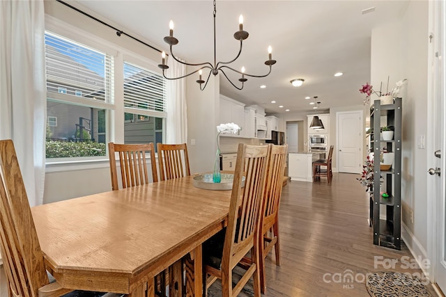 1906 Pensco Pond Ct, Waxhaw, NC 28173 - dining room featuring dark wood-style flooring, plenty of natural light, a chandelier, and recessed lighting