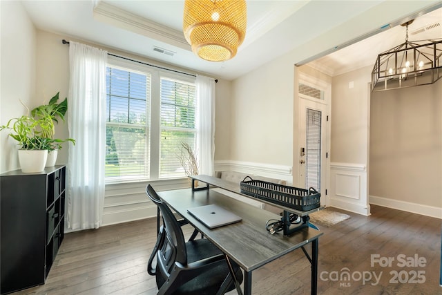 1906 Pensco Pond Ct, Waxhaw, NC 28173 - home office with a chandelier, ornamental molding, dark wood-type flooring, a wainscoted wall, and a raised ceiling