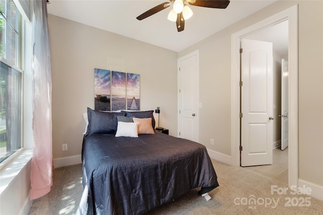 1906 Pensco Pond Ct, Waxhaw, NC 28173 - bedroom with light colored carpet, multiple windows, and a ceiling fan