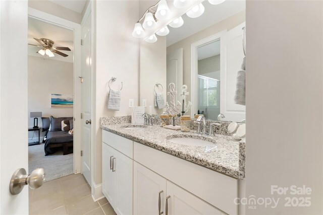 1906 Pensco Pond Ct, Waxhaw, NC 28173 - ensuite bathroom with double vanity, a ceiling fan, tile patterned flooring, and a shower stall