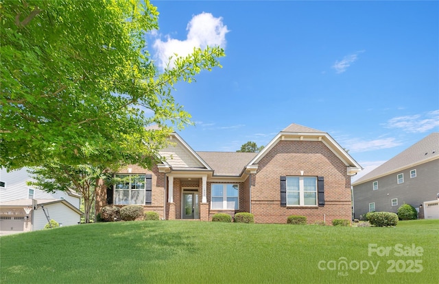 1906 Pensco Pond Ct, Waxhaw, NC 28173 - craftsman-style home with brick siding and a front lawn