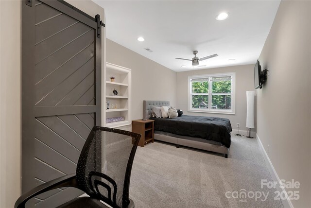 1906 Pensco Pond Ct, Waxhaw, NC 28173 - bedroom featuring a barn door, carpet, a ceiling fan, and recessed lighting