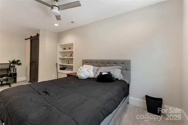 1906 Pensco Pond Ct, Waxhaw, NC 28173 - carpeted bedroom featuring a barn door and ceiling fan