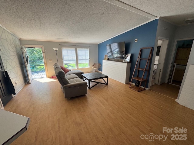 13211 Asbury Chapel Rd, Huntersville, NC 28078 - living area featuring wood finished floors, a textured ceiling, crown molding, and baseboards