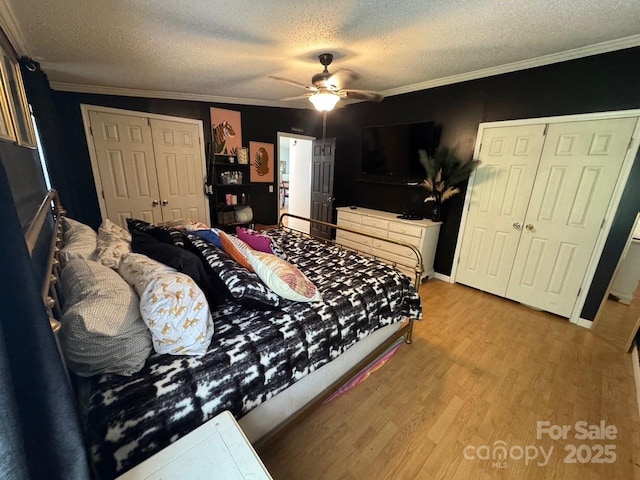 13211 Asbury Chapel Rd, Huntersville, NC 28078 - bedroom featuring a textured ceiling, wood finished floors, ornamental molding, a closet, and ceiling fan