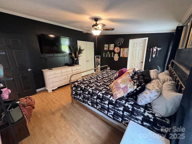 13211 Asbury Chapel Rd, Huntersville, NC 28078 - bedroom with ornamental molding, light wood-type flooring, a textured ceiling, and a ceiling fan