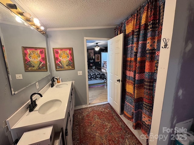 13211 Asbury Chapel Rd, Huntersville, NC 28078 - full bathroom with crown molding, a textured ceiling, double vanity, and a ceiling fan