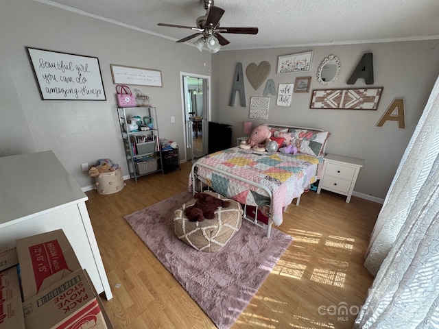 13211 Asbury Chapel Rd, Huntersville, NC 28078 - bedroom featuring crown molding, wood finished floors, ceiling fan, and baseboards