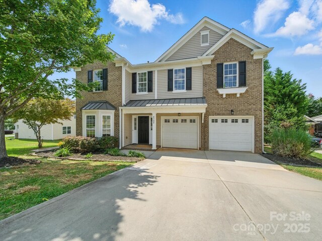 8304 Prescott Glen Pkwy, Waxhaw, NC 28173 - multi unit property featuring concrete driveway, a garage, a standing seam roof, brick siding, and metal roof
