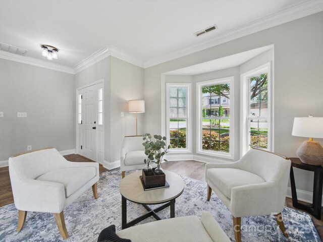 8304 Prescott Glen Pkwy, Waxhaw, NC 28173 - living area featuring crown molding, baseboards, and wood finished floors