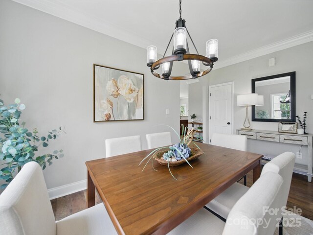 8304 Prescott Glen Pkwy, Waxhaw, NC 28173 - dining space featuring a chandelier, crown molding, dark wood-style flooring, and baseboards