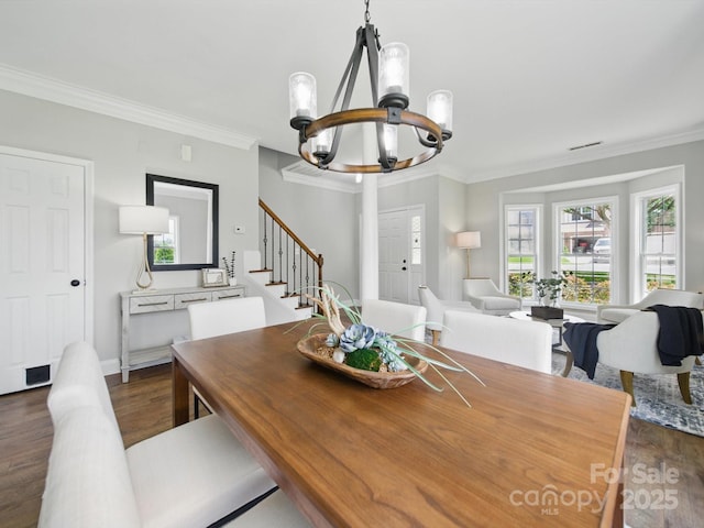 8304 Prescott Glen Pkwy, Waxhaw, NC 28173 - dining area with a chandelier, dark wood-type flooring, stairway, and ornamental molding