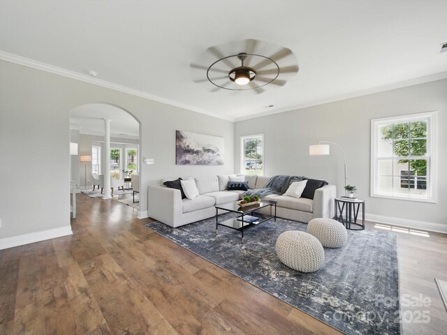 8304 Prescott Glen Pkwy, Waxhaw, NC 28173 - living area featuring arched walkways, a ceiling fan, wood finished floors, ornamental molding, and plenty of natural light