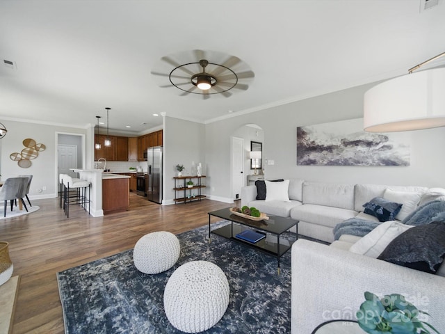 8304 Prescott Glen Pkwy, Waxhaw, NC 28173 - living area featuring arched walkways, dark wood-type flooring, ornamental molding, baseboards, and recessed lighting