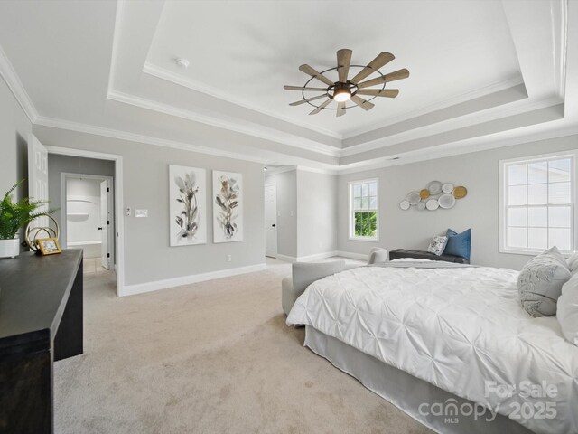 8304 Prescott Glen Pkwy, Waxhaw, NC 28173 - bedroom with a tray ceiling, light colored carpet, crown molding, baseboards, and ceiling fan