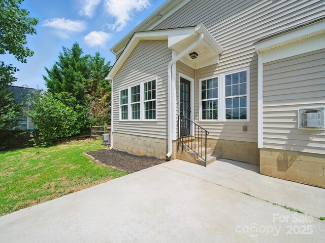 8304 Prescott Glen Pkwy, Waxhaw, NC 28173 - entrance to property with a patio area and a yard