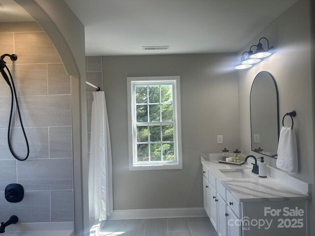 8304 Prescott Glen Pkwy, Waxhaw, NC 28173 - full bath with vanity, a tile shower, baseboards, and tile patterned floors