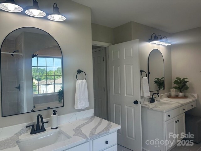 8304 Prescott Glen Pkwy, Waxhaw, NC 28173 - full bath featuring two vanities and tiled shower
