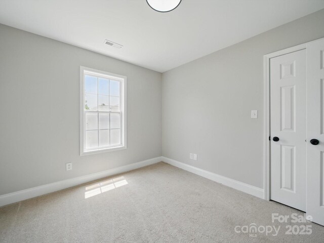 8304 Prescott Glen Pkwy, Waxhaw, NC 28173 - carpeted empty room with baseboards
