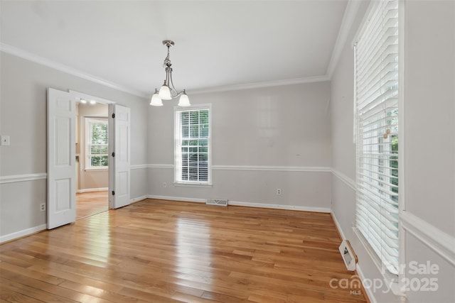 1517 E Barden Rd, Charlotte, NC 28226 - empty room with light wood finished floors, ornamental molding, and a chandelier
