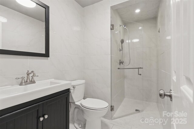 1517 E Barden Rd, Charlotte, NC 28226 - full bathroom with tile walls, a stall shower, and vanity