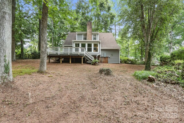 1517 E Barden Rd, Charlotte, NC 28226 - back of property with a deck, stairway, a chimney, a sunroom, and a shingled roof
