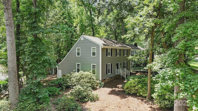 1517 E Barden Rd, Charlotte, NC 28226 - view of front of property with crawl space and a wooded view