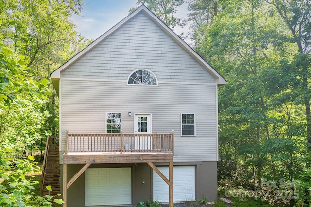 109 Tumblebug Trail Rd, Flat Rock, NC 28731 - rear view of property featuring an attached garage and a deck