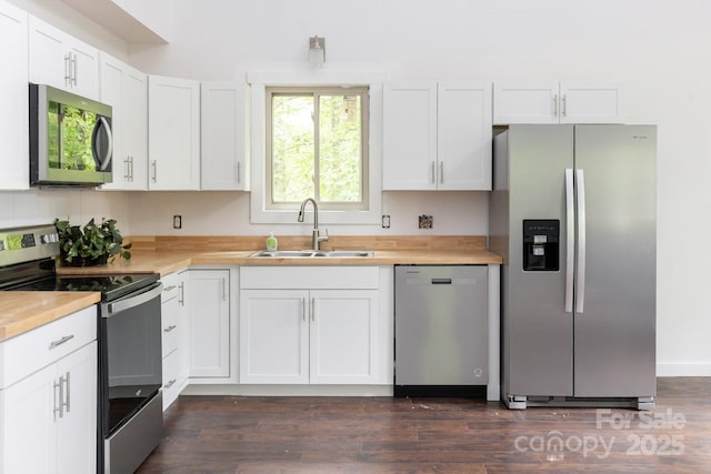 109 Tumblebug Trail Rd, Flat Rock, NC 28731 - kitchen featuring stainless steel appliances, white cabinets, dark wood finished floors, and butcher block counters