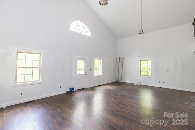 109 Tumblebug Trail Rd, Flat Rock, NC 28731 - unfurnished living room with high vaulted ceiling, plenty of natural light, and dark wood-type flooring