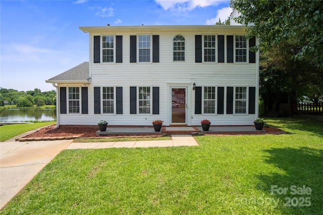 6516 Laurel Springs Ct, Charlotte, NC 28227 - colonial house featuring a water view and a front lawn